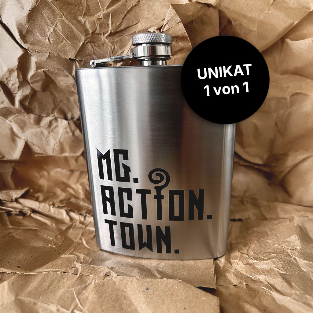 Flachmann MG.ACTION.TOWN Logo